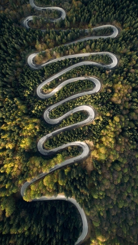 stunning twist road in romania, drone view