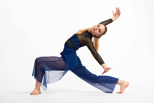 Controlled stretch demonstrating dancer’s flexibility.