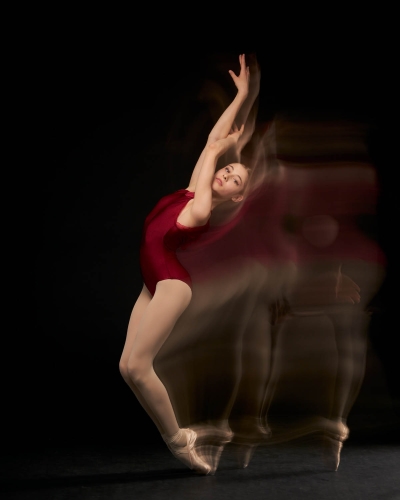 Professional dancer in mid-motion, showcasing fluid movement.