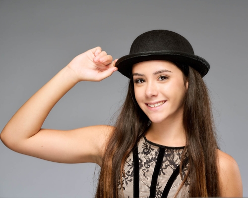 happy woman posing for a professional studio portrait